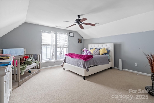 bedroom featuring lofted ceiling, carpet, visible vents, and baseboards