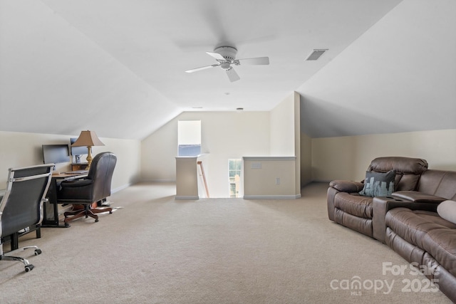 carpeted office featuring a ceiling fan, lofted ceiling, visible vents, and baseboards