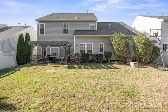 back of property with a lawn, a fenced backyard, roof with shingles, a patio area, and a pergola