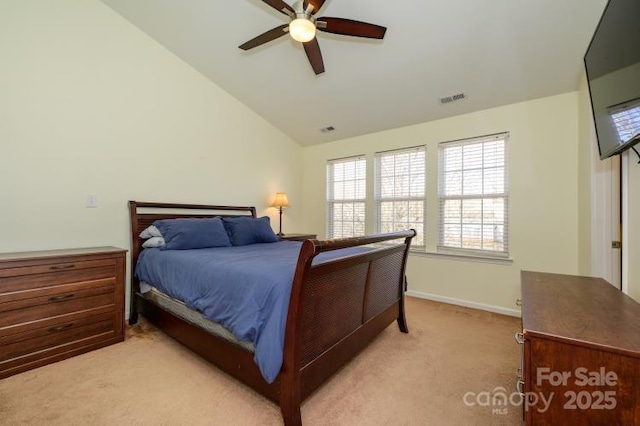 bedroom featuring light carpet, visible vents, baseboards, lofted ceiling, and ceiling fan