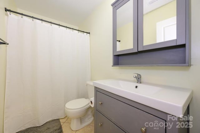 full bathroom with visible vents, vanity, toilet, and tile patterned floors