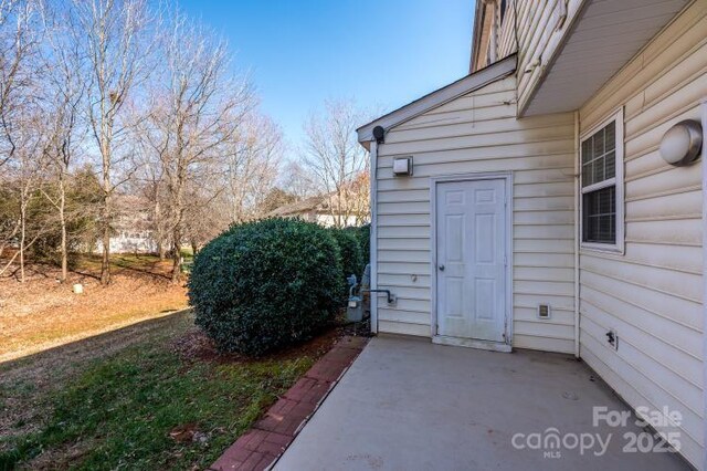 doorway to property featuring a patio area