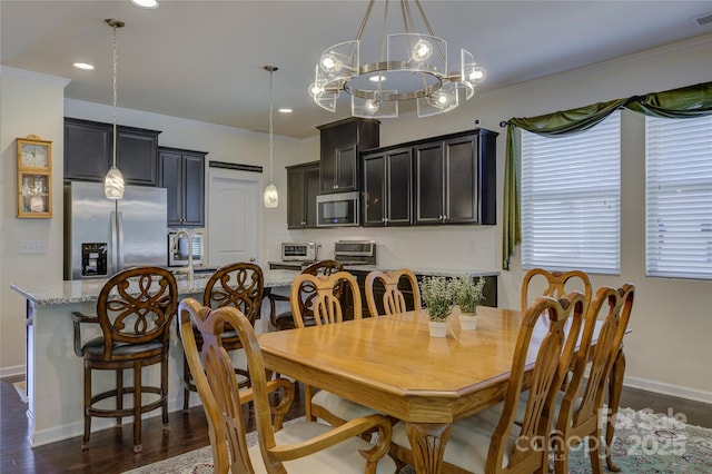 dining space with crown molding, visible vents, dark wood finished floors, and baseboards