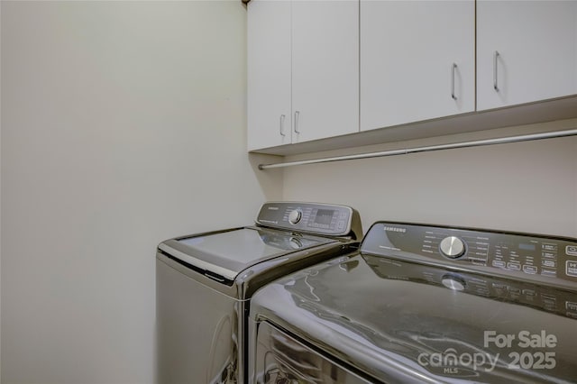 laundry area featuring cabinet space and independent washer and dryer