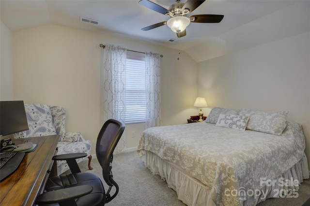 bedroom with lofted ceiling, baseboards, visible vents, and light colored carpet