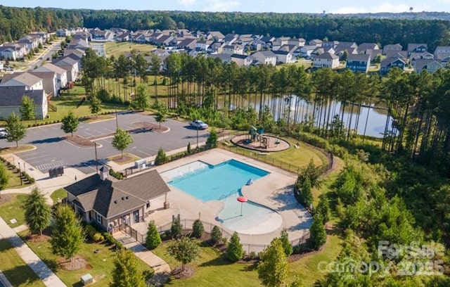 bird's eye view with a residential view and a water view