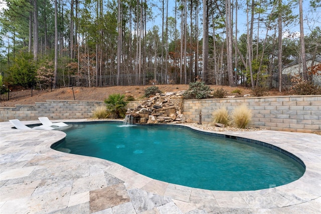 view of pool featuring a patio, a fenced backyard, and a fenced in pool