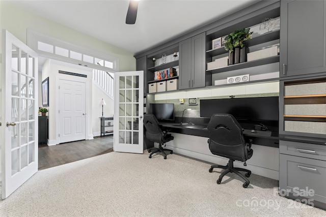 office space with french doors and wood finished floors