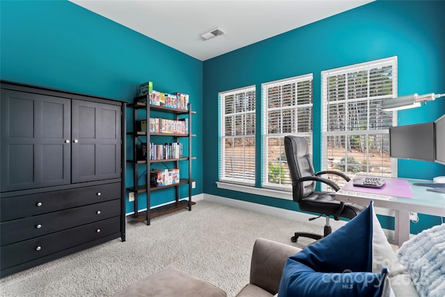 home office with carpet floors, visible vents, and baseboards