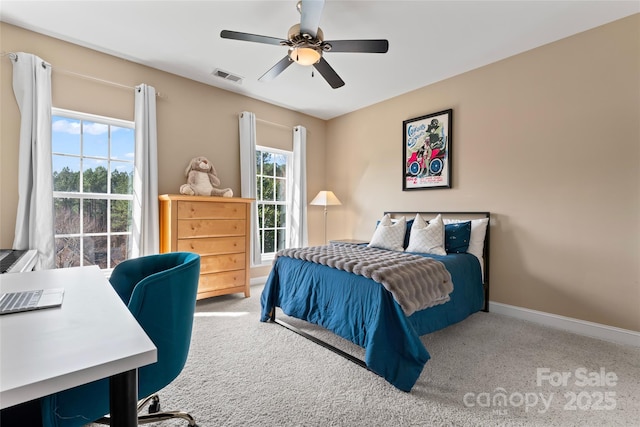 bedroom featuring baseboards, visible vents, ceiling fan, and carpet flooring