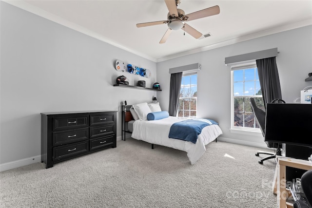 bedroom featuring crown molding, visible vents, a ceiling fan, light carpet, and baseboards