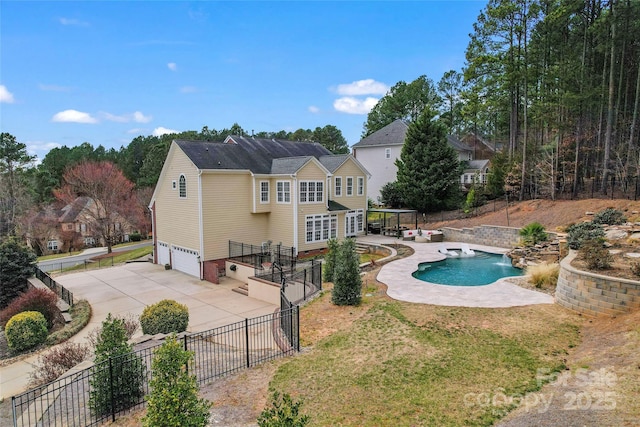 view of swimming pool featuring a fenced in pool, a yard, fence, and a patio