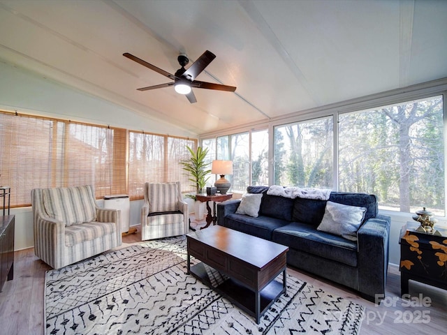 sunroom / solarium featuring lofted ceiling and ceiling fan