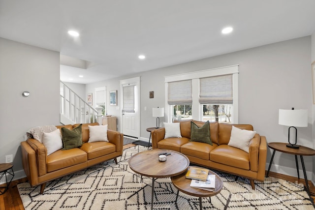 living area featuring recessed lighting, stairway, baseboards, and wood finished floors