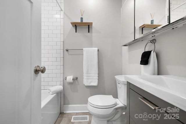 bathroom featuring visible vents, baseboards, toilet, tile patterned floors, and vanity