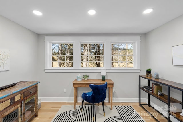 home office featuring recessed lighting, light wood-style floors, and baseboards