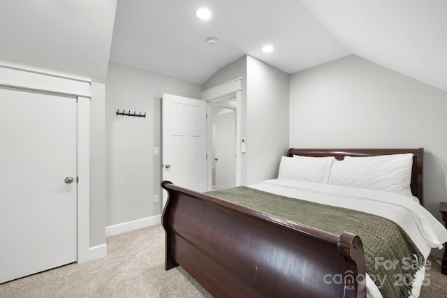 bedroom featuring lofted ceiling, recessed lighting, baseboards, and light carpet