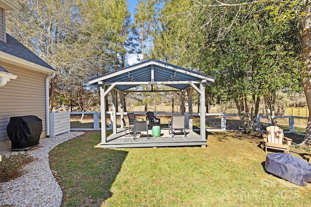 view of yard with a gazebo, a fenced backyard, and a wooden deck