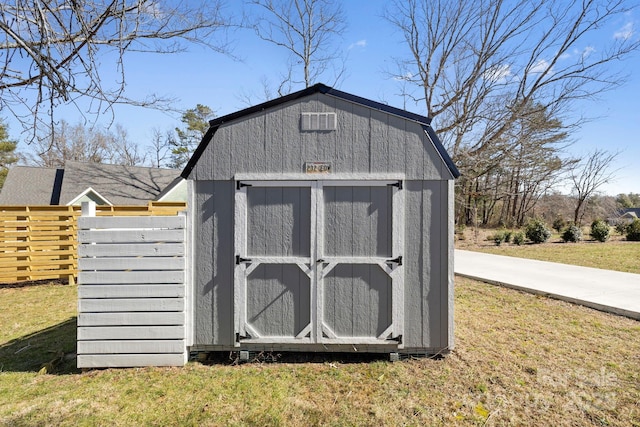 view of shed with fence