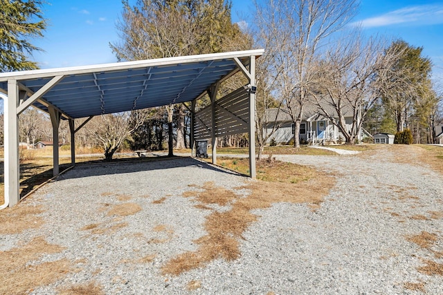 exterior space featuring a detached carport and driveway