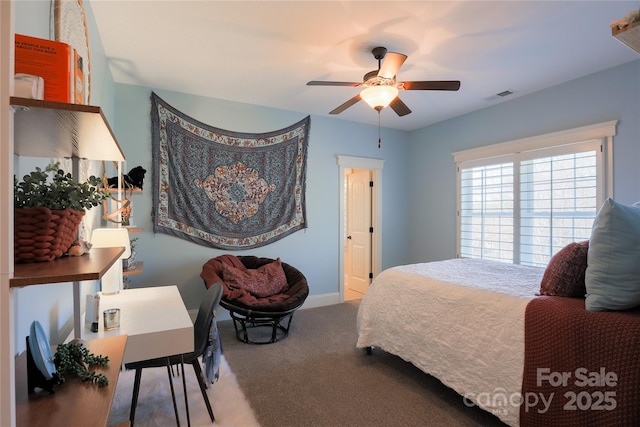 carpeted bedroom featuring visible vents and a ceiling fan