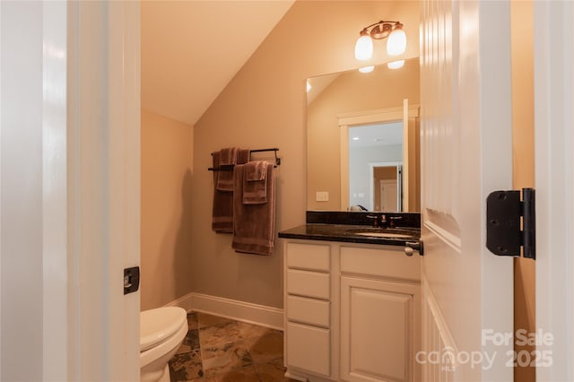 half bath featuring baseboards, lofted ceiling, toilet, marble finish floor, and vanity