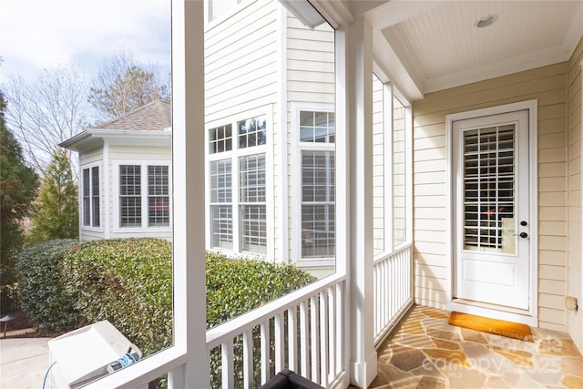 entrance to property with a shingled roof