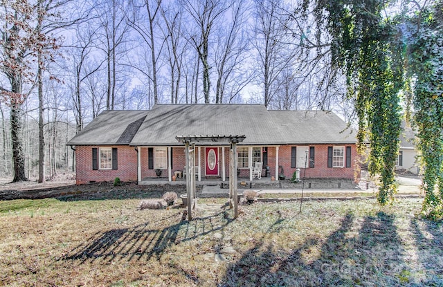 view of front facade with a front yard and brick siding