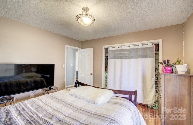 bedroom featuring a textured ceiling