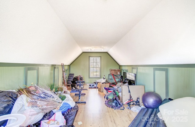 interior space with lofted ceiling and wood finished floors