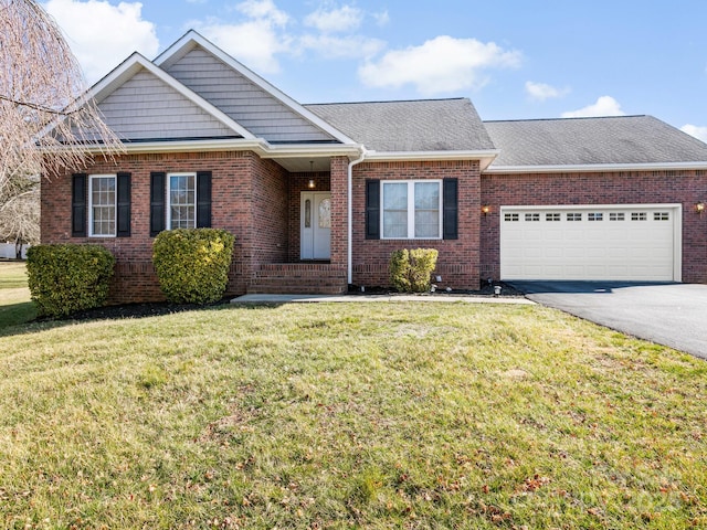 view of front of home with a garage, aphalt driveway, and brick siding