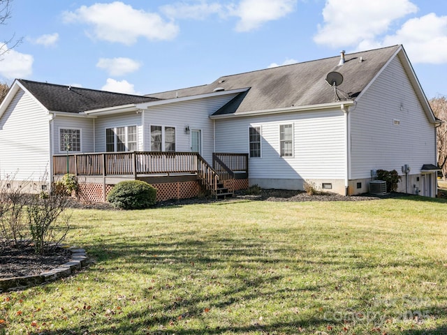 back of property with a yard, crawl space, cooling unit, and a wooden deck