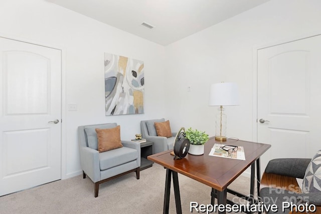 office space featuring visible vents and light colored carpet