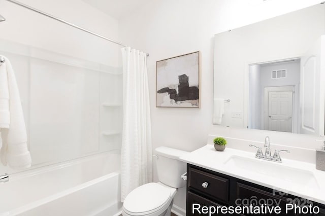 bathroom featuring toilet, shower / tub combo, visible vents, and vanity