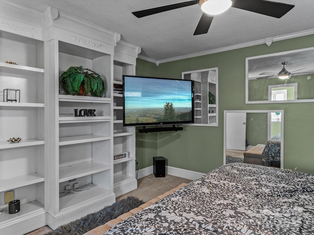 bedroom featuring ornamental molding, a textured ceiling, and baseboards