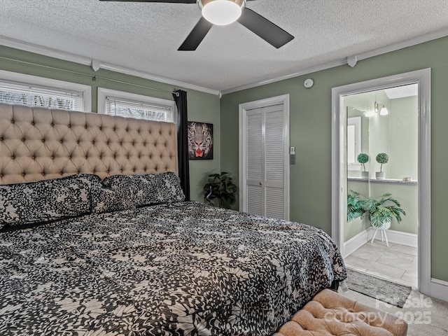 bedroom with ensuite bath, ceiling fan, crown molding, a textured ceiling, and a closet