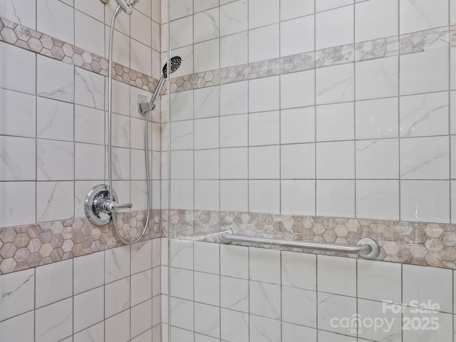 full bathroom with tiled shower