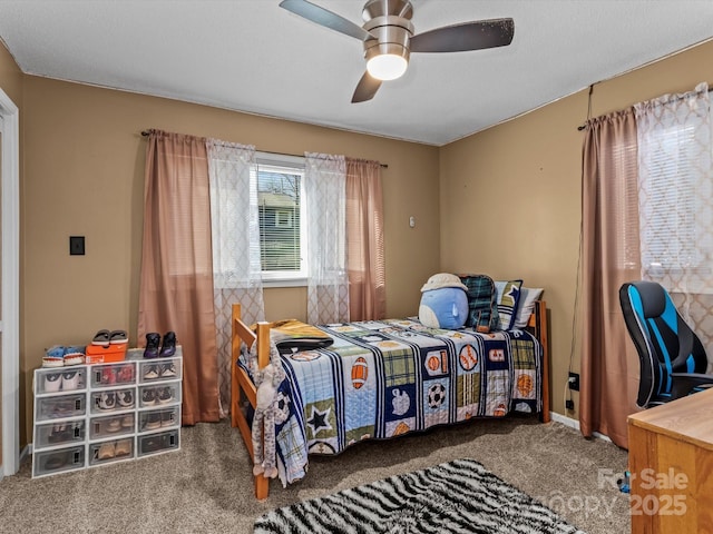 bedroom featuring carpet floors and a ceiling fan