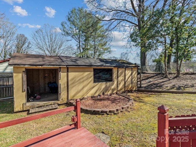 view of shed with fence