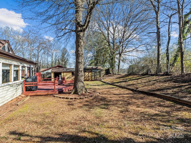 view of yard with a fenced backyard and a deck