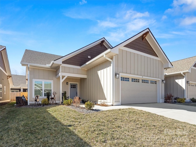 view of front of house with a garage, concrete driveway, board and batten siding, and a front yard