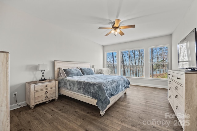 bedroom with ceiling fan, multiple windows, baseboards, and dark wood-style flooring