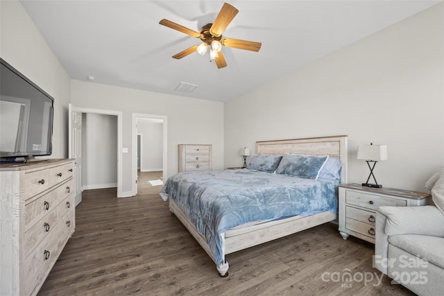 bedroom featuring dark wood-style floors, visible vents, baseboards, and a ceiling fan