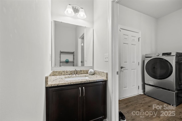 bathroom with vanity and wood finished floors