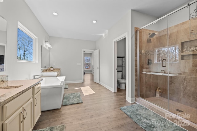 13701 Petworth Ct, Charlotte, NC 28278 - bathroom with a stall shower, healthy amount of natural light, wood finished floors, and recessed lighting