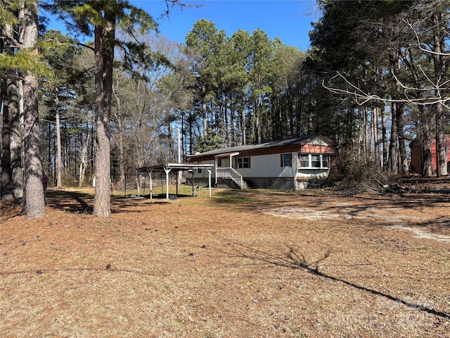 view of front of house with a carport