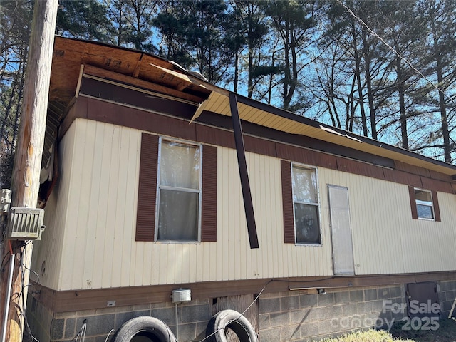 view of side of property featuring crawl space