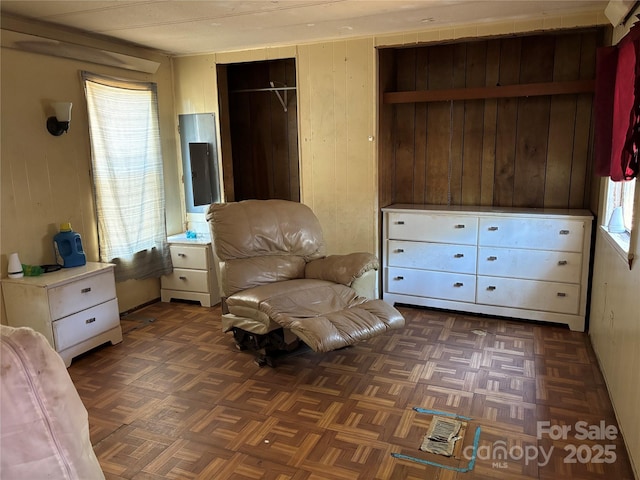 sitting room with wood walls