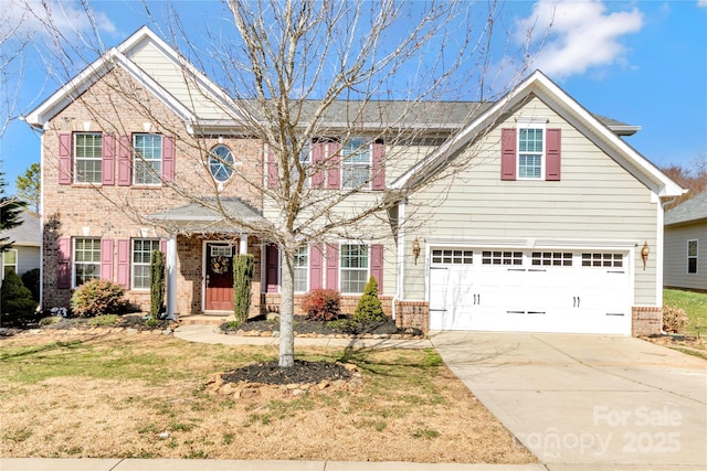 view of front of house featuring concrete driveway, brick siding, and a front yard