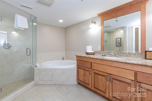 bathroom featuring a garden tub, vanity, visible vents, a shower stall, and tile patterned floors